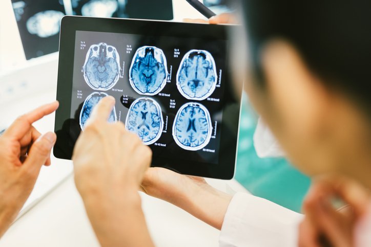 Doctor and patient using digital tablet