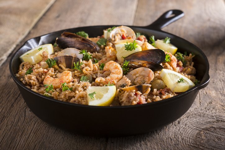 Paella -- Spanish Seafood and Rice Dish in Skillet