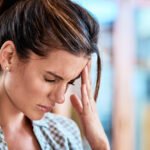 woman suffering with a headache
